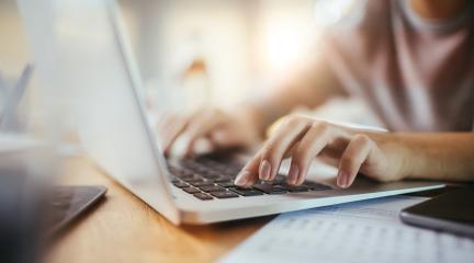 Person typing on a laptop