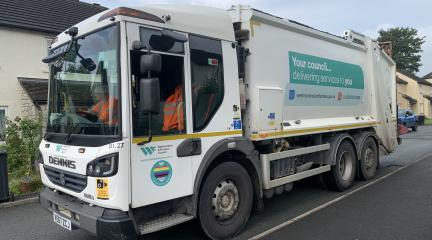 A Westmorland and Furness bin wagon making a kerbside collection