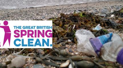 A plastic bottle on a beach.