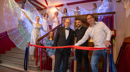 Westmorland and Furness Bowness and Lyth councillor Steve Bavin (right) cuts the ribbon to mark the re-opening of the Royalty, watched by new leaseholder Bryn Tyson (centre) and business partner Mark Naunton