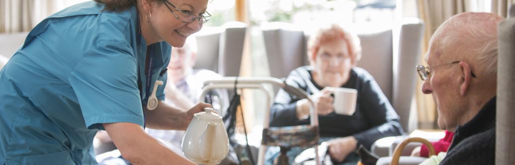 Care worker looking after elderly residents