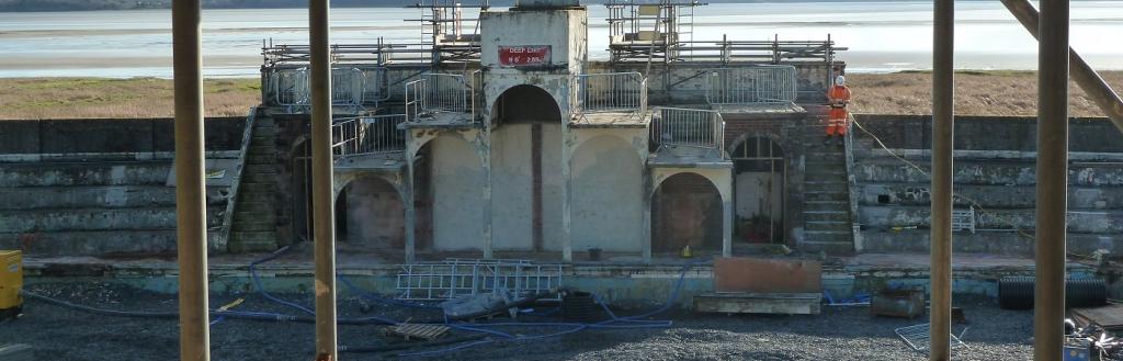 A derelict diving platform viewed through scaffolding poles