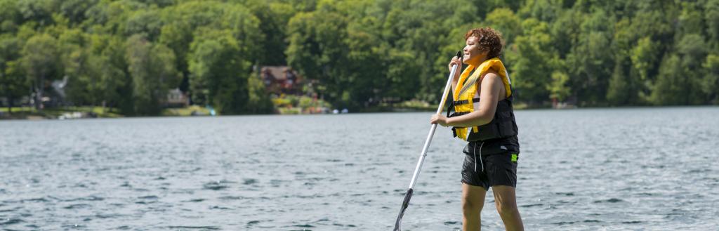 boy on kayak, happy, smiling