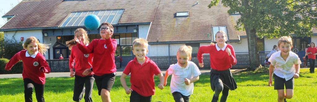 Children running in school field