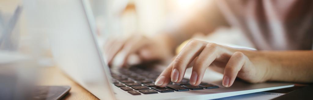 Person typing on a laptop