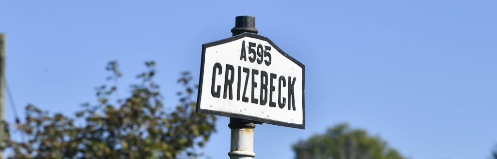 Black and white A595 Grizebeck road sign