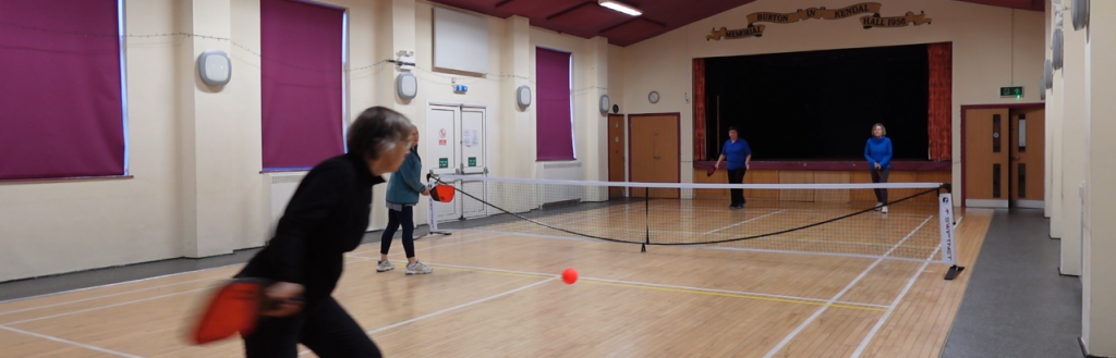 People playing pickleball.