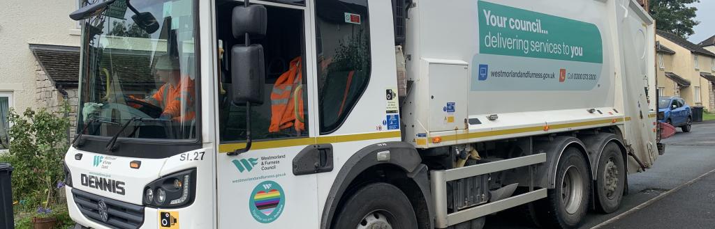 A Westmorland and Furness bin wagon making a kerbside collection