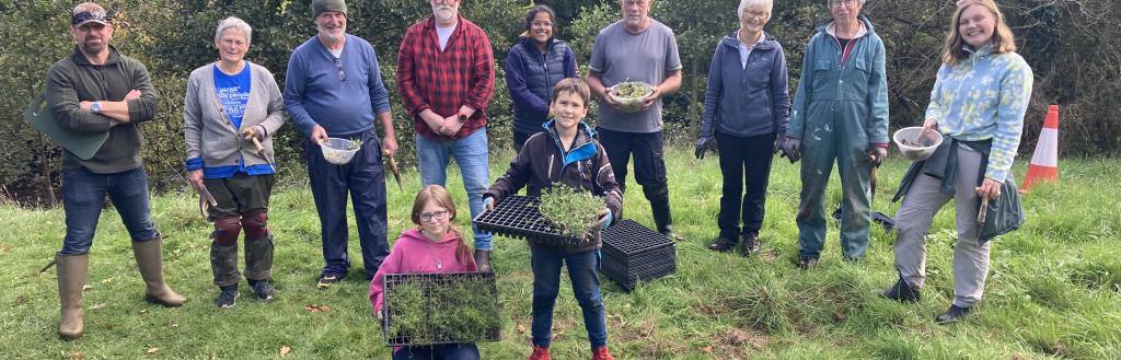 A group of volunteers from a Planting for Pollinators planting day.