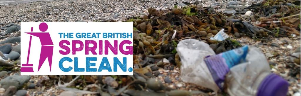 A plastic bottle on a beach.